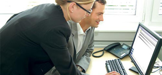 Couple looking at PC based entry system