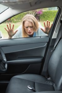 Woman locked out of car, keys shown on car seat locked inside